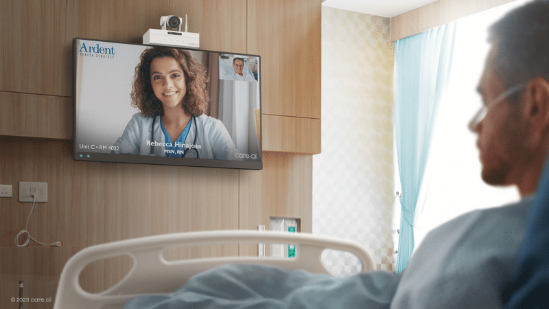 man in hospital bed video conferencing with a woman